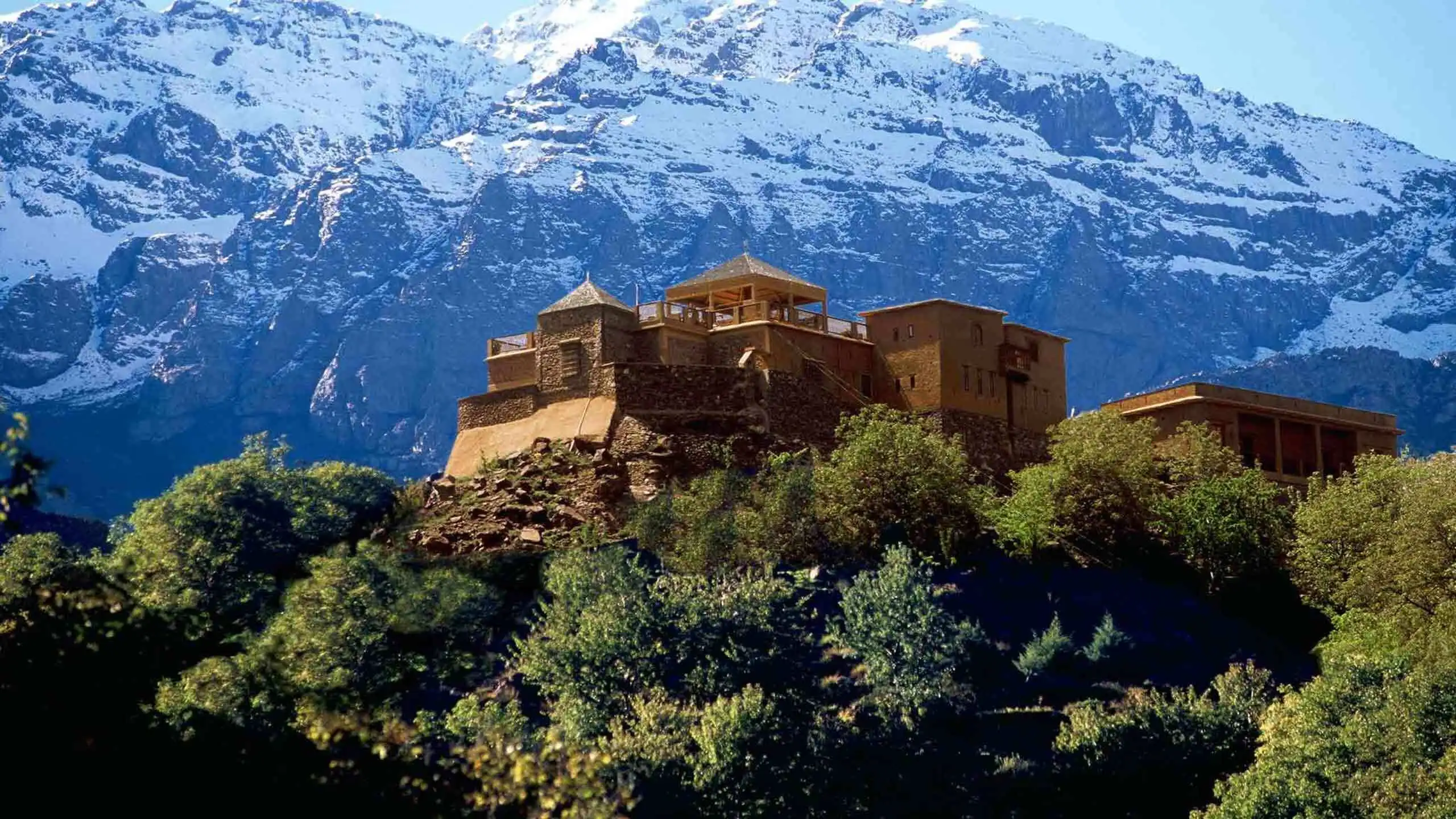 High Atlas Mountain trail near Imlil with views of Berber villages – trekking with Sahara Trails 
